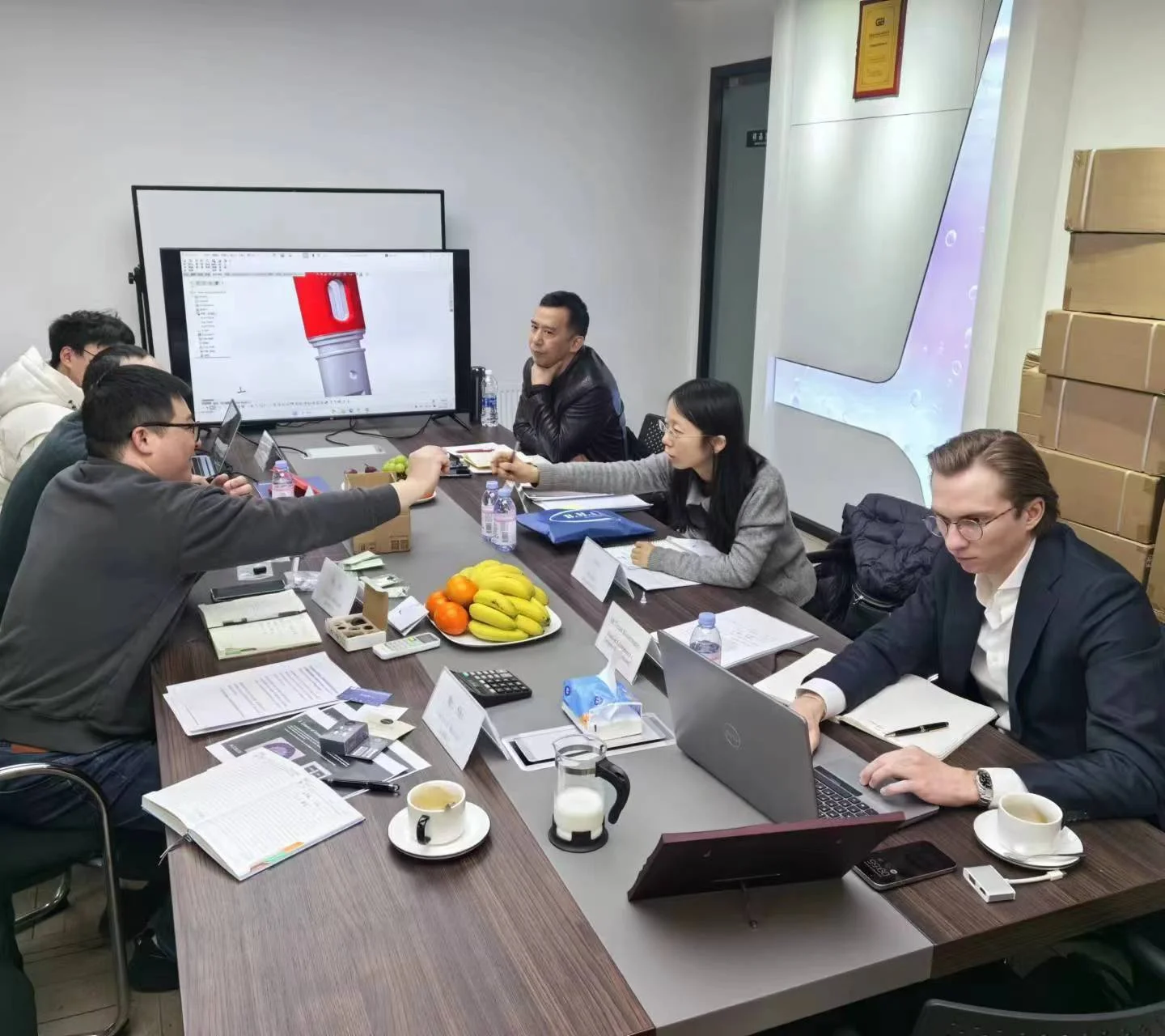Project team discussing product development at the factory