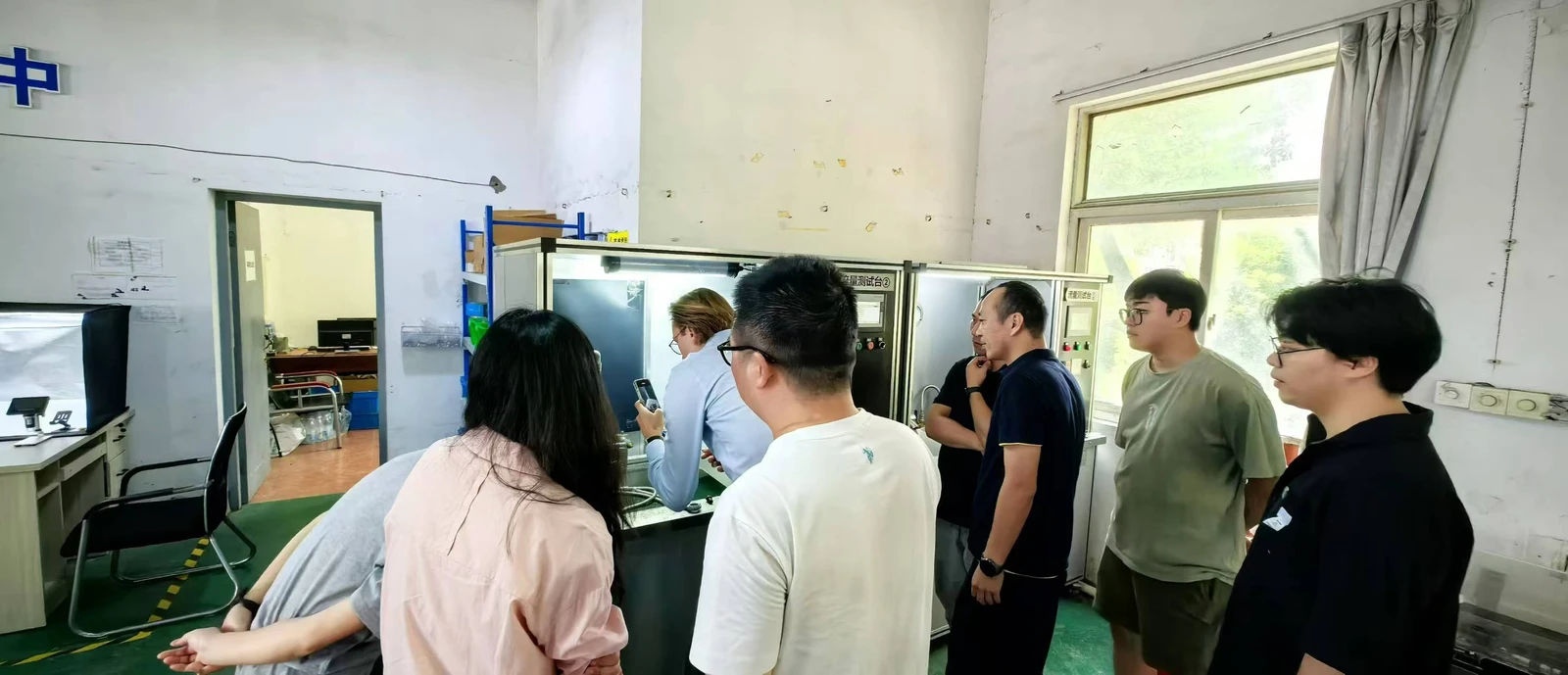 Project team evaluating samples at the factory test station