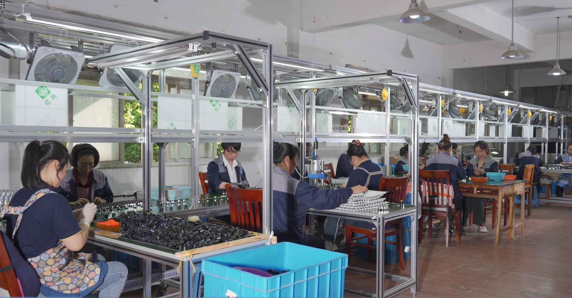 Production team assembling water-saving components